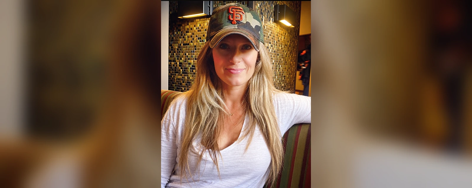 Libby Mays wearing a San Francisco Giants cap